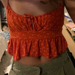 this cottage core, flower pattern, tie, spaghetti top is perfect for summer!